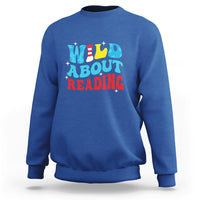 Royal blue reading sweatshirt with 'WILD ABOUT READING' front graphic