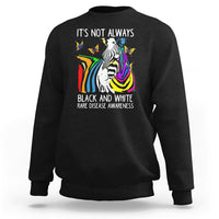 Kids black crewneck sweatshirt with zebra and rainbow awareness graphic on front.