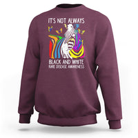 Kids maroon crewneck sweatshirt with zebra and rainbow awareness graphic on front.