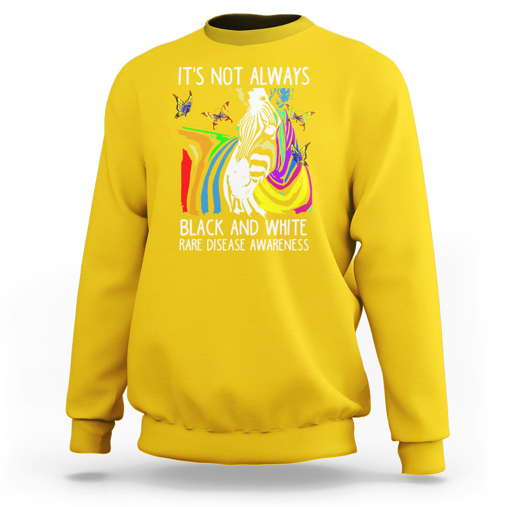 Kids daisy yellow crewneck sweatshirt with zebra and rainbow awareness graphic on front.