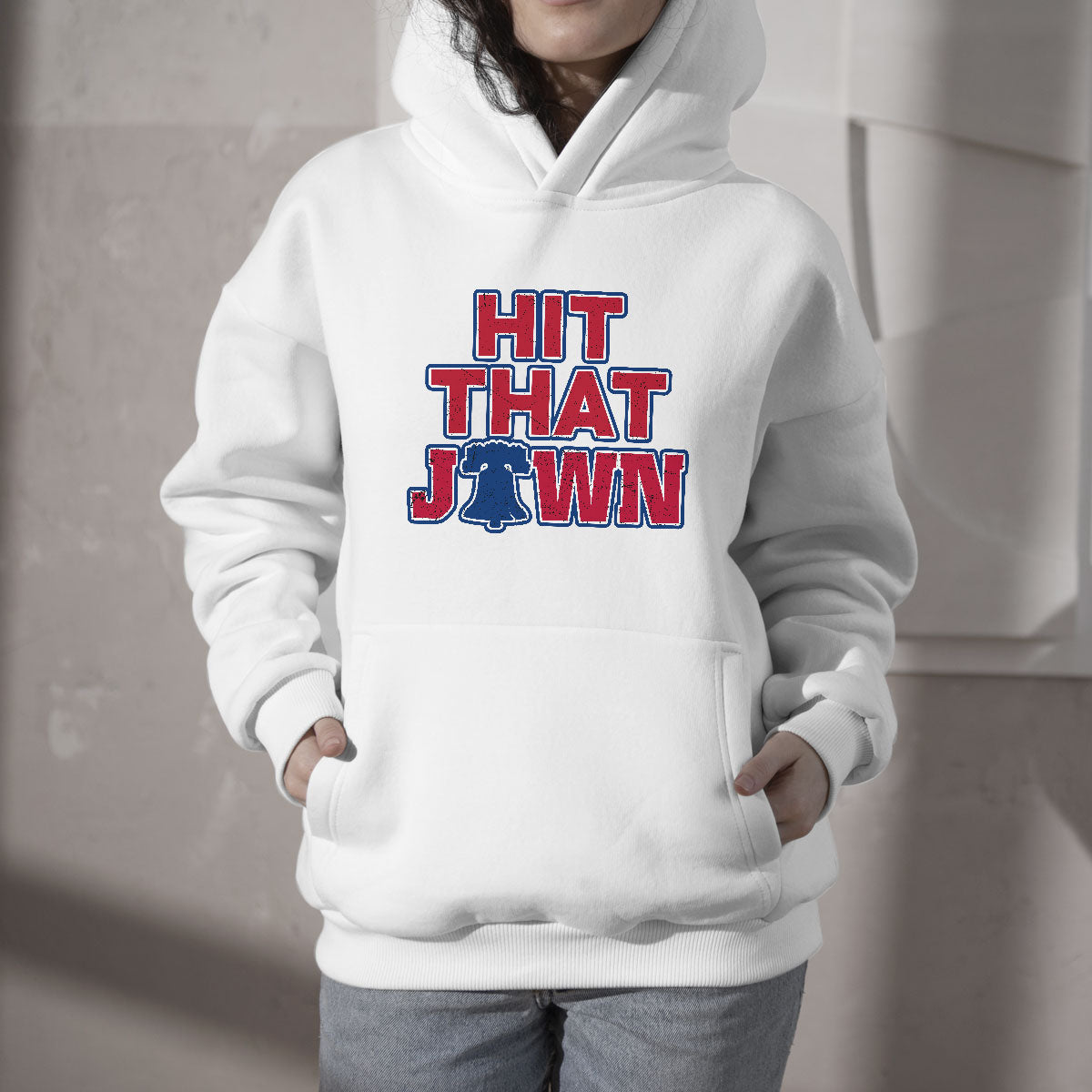 White hooded sweatshirt with front pocket and centered 'HIT THAT JAWN' graphic