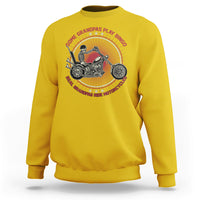 Yellow crewneck sweatshirt with biker graphic and round text on back