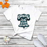 White crew-neck T-shirt with colorful "Dancing On Our Own" graphic front.