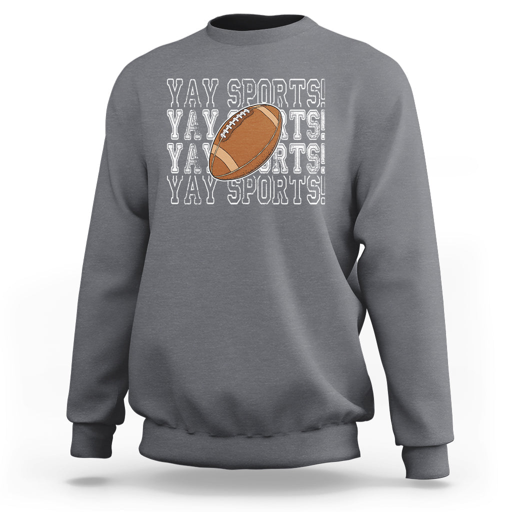 Light gray crewneck sweatshirt with football graphic and “YAY SPORTS” text print
