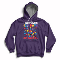 Purple pullover hoodie with colorful puzzle heart graphic and “I Survived 120 Days of School” text