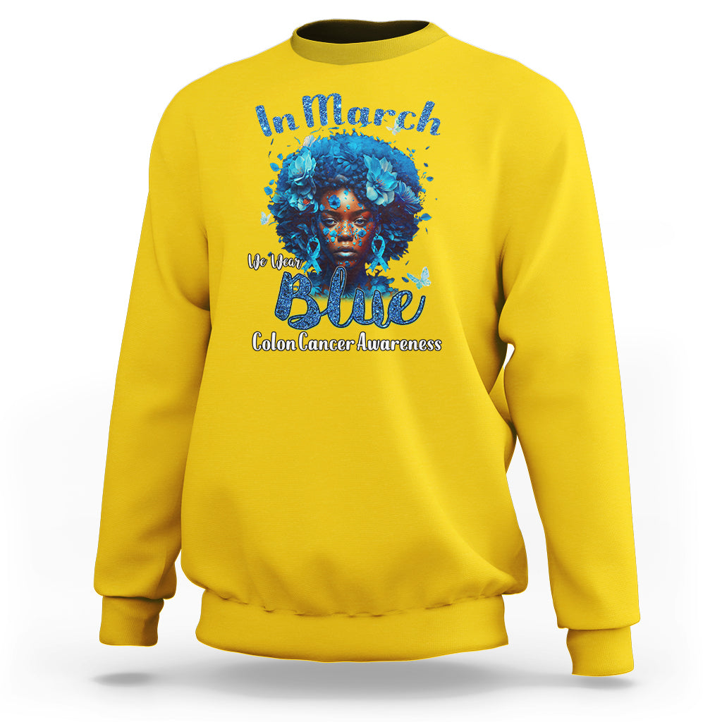 Daisy yellow crewneck sweatshirt with blue colon cancer ribbon portrait graphic on front