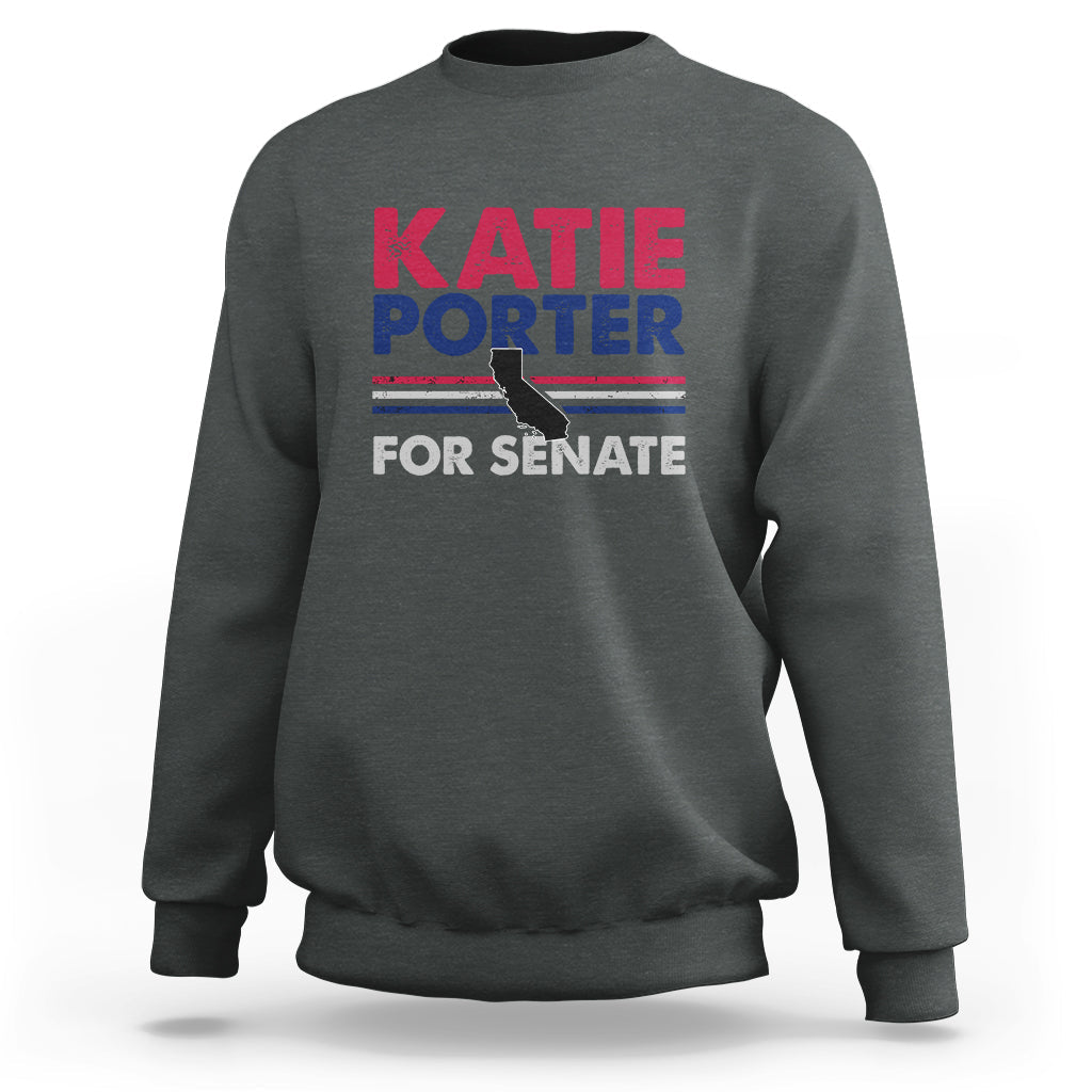 Dark heather crewneck sweatshirt with front graphic text: KATIE PORTER FOR SENATE