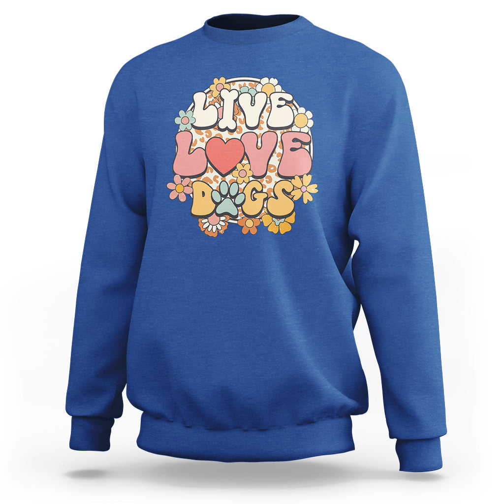 Royal blue sweatshirt with “LIVE LOVE DOGS” graphic, colorful paw and flower design