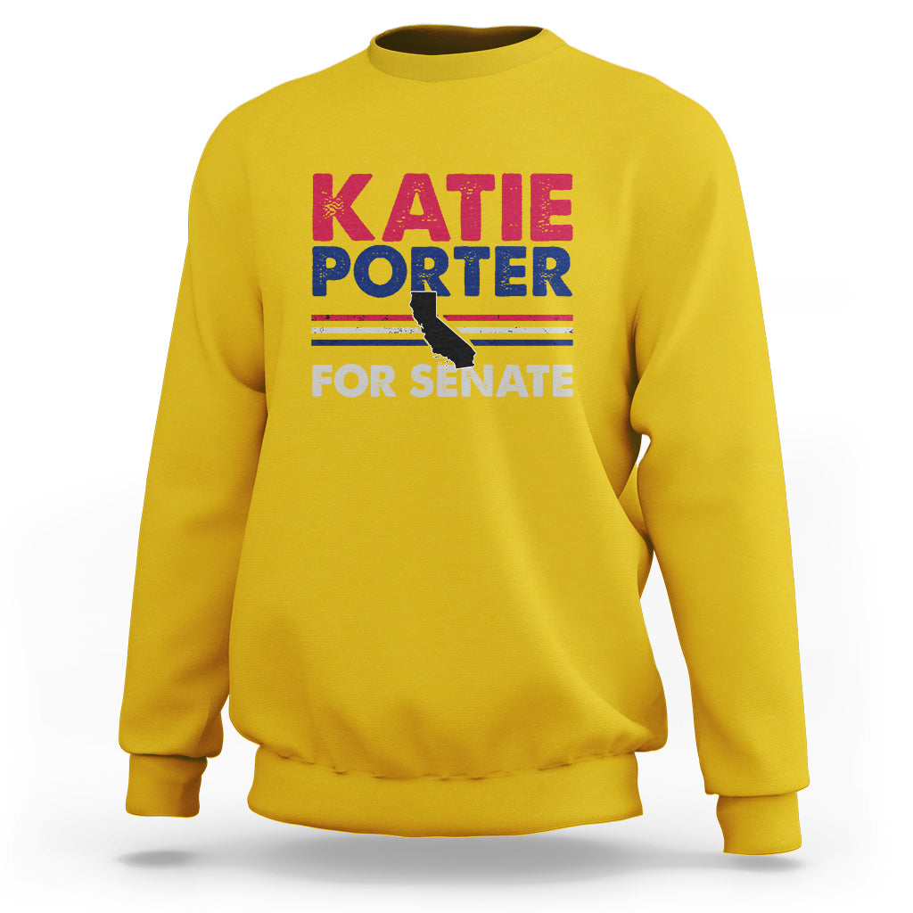 Daisy yellow crewneck sweatshirt with front graphic text: KATIE PORTER FOR SENATE