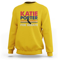 Daisy yellow crewneck sweatshirt with front graphic text: KATIE PORTER FOR SENATE