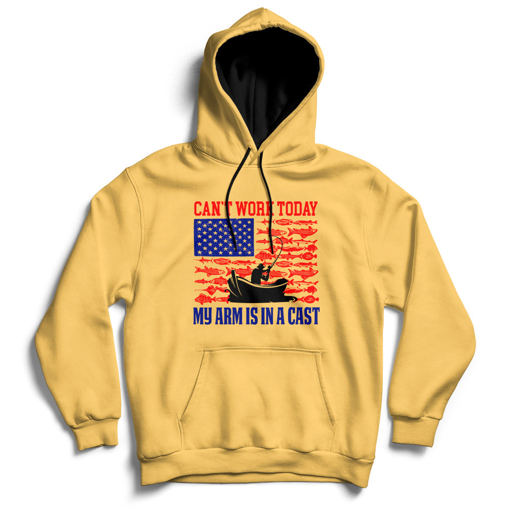 Yellow hoodie with US-flag themed graphic and text: “CAN’T WORK TODAY” and “MY ARM IS IN A CAST”.