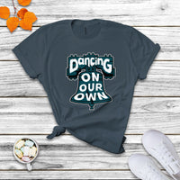 Dark gray-blue crew-neck T-shirt with colorful "Dancing On Our Own" graphic front.