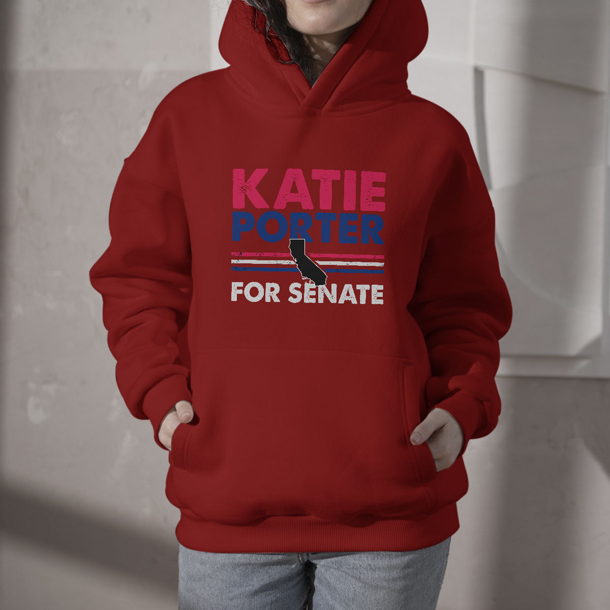 Red hoodie with hood, front pouch, and "KATIE PORTER FOR SENATE" graphic