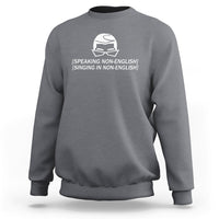 Heather gray crewneck sweatshirt with white helmet graphic and speaking/singing text on chest