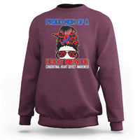 Maroon crewneck sweatshirt with front warrior heart graphic and message print