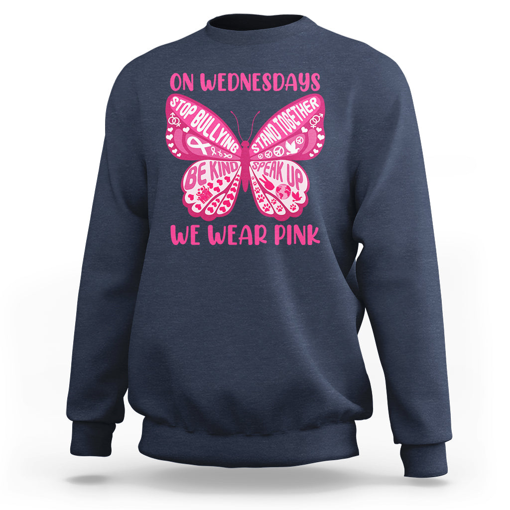 Navy crewneck sweatshirt with pink butterfly anti-bullying graphic and slogan text