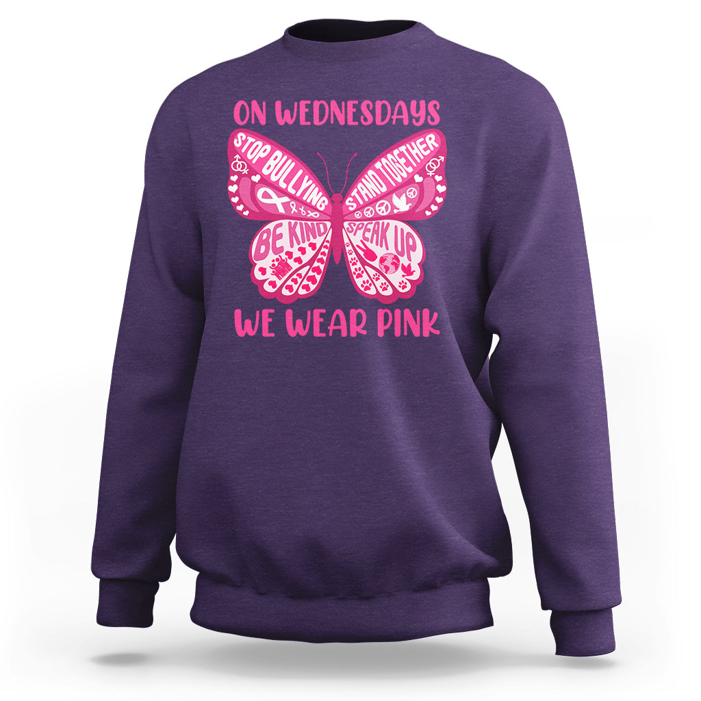 Purple crewneck sweatshirt with pink butterfly anti-bullying graphic and slogan text