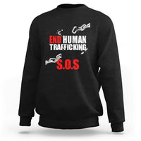 Black crewneck sweatshirt with 'END HUMAN TRAFFICKING' and red 'S.O.S.' graphic
