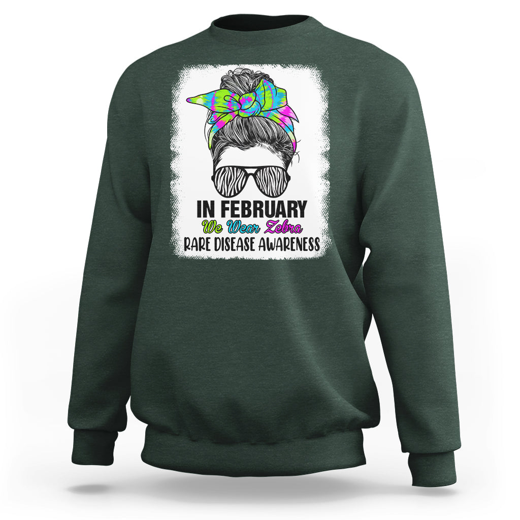 Forest green crewneck sweatshirt with zebra messy-bun graphic and 'Rare Disease Awareness'
