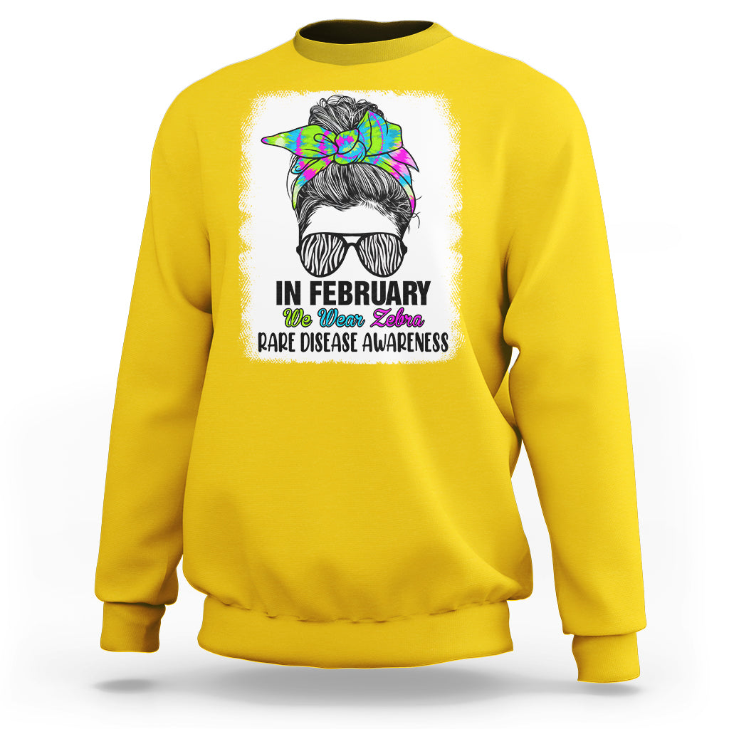 Daisy yellow crewneck sweatshirt with zebra messy-bun graphic and 'Rare Disease Awareness'
