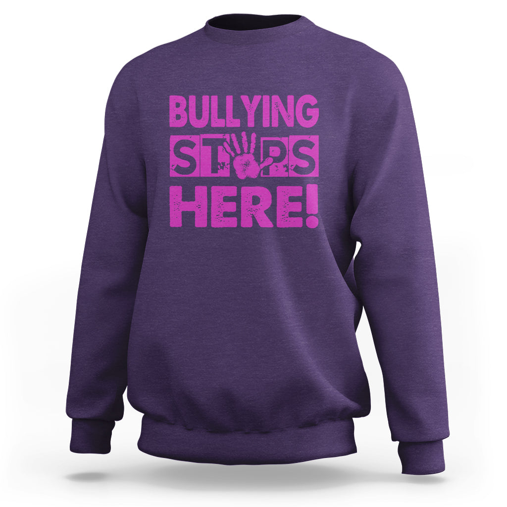 Purple crewneck sweatshirt with “BULLYING STARS HERE!” pink text graphic