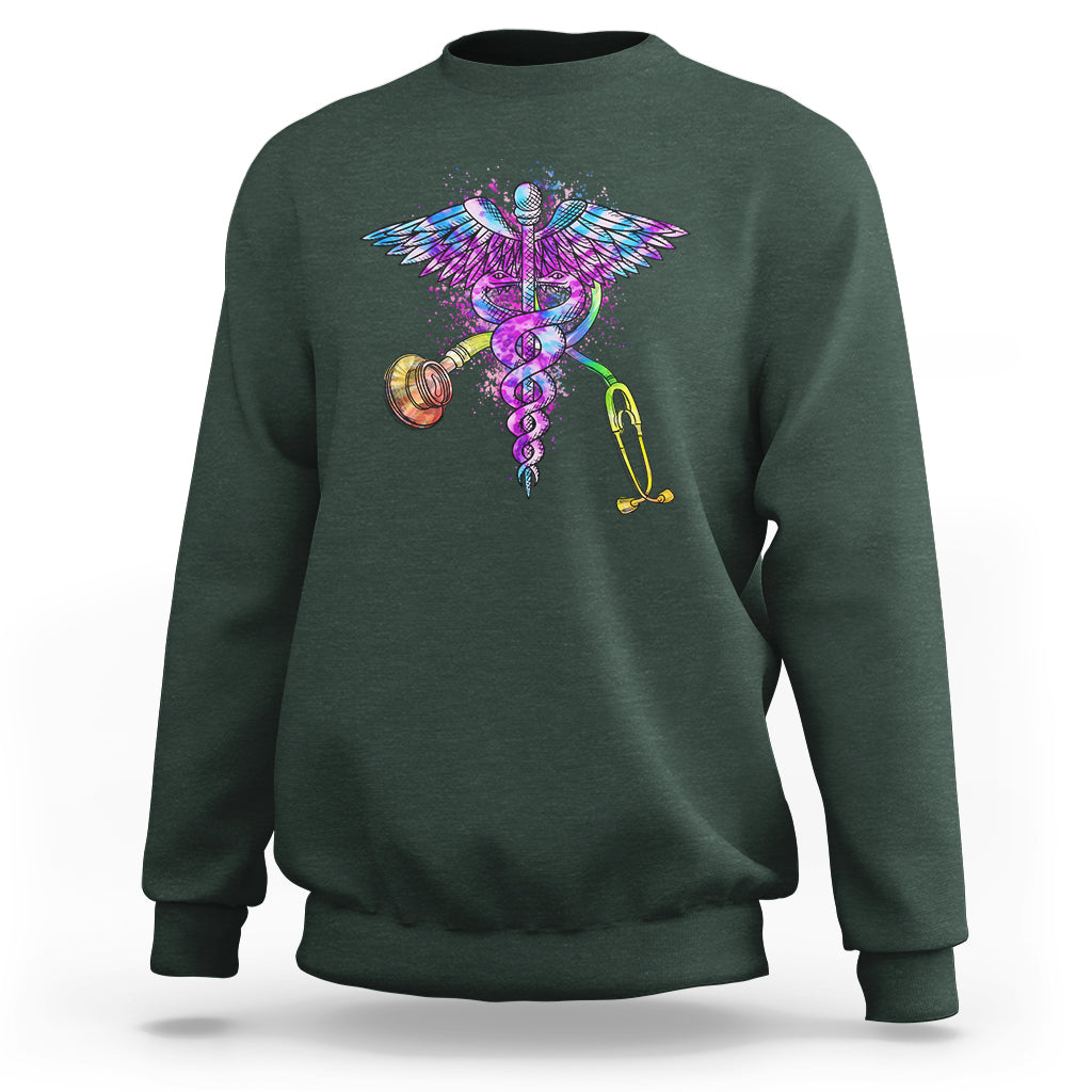 Forest green crewneck sweatshirt with colorful stethoscope and wings graphic.