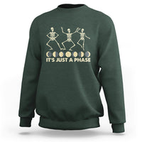 Forest green crewneck sweatshirt with dancing skeleton graphic and “IT’S JUST A PHASE” text