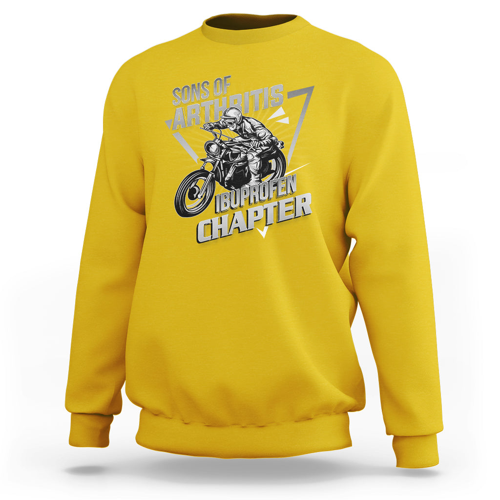 Yellow crewneck sweatshirt with biker skeleton graphic and bold text print