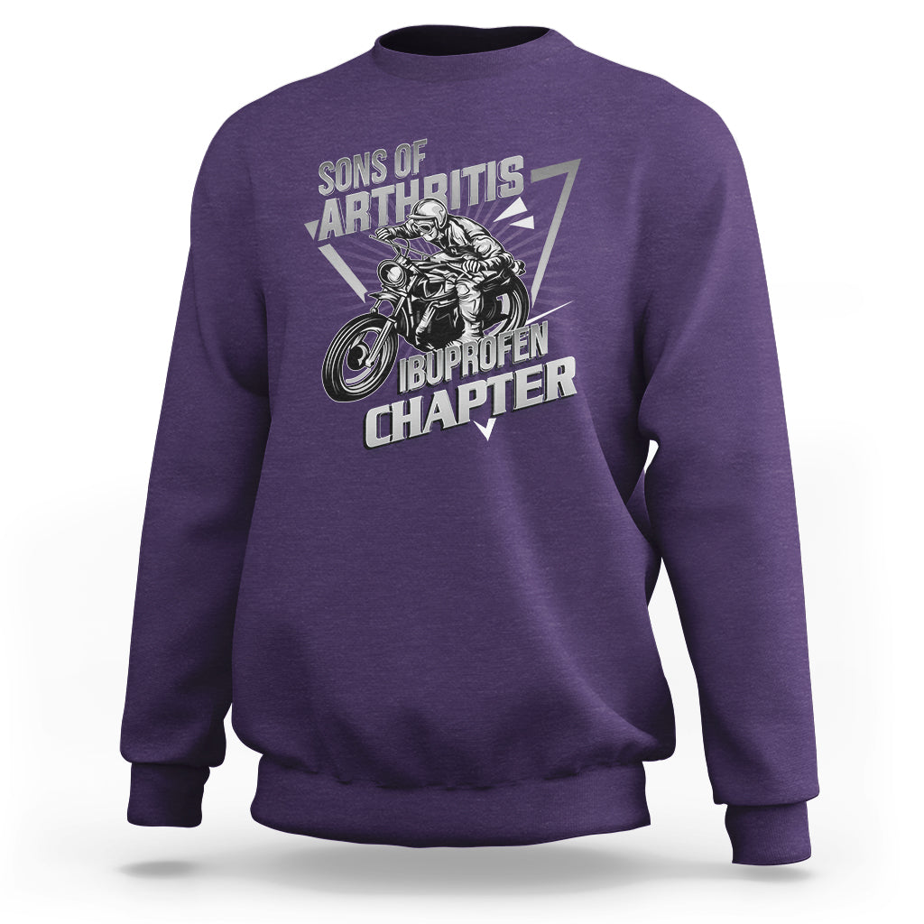Purple crewneck sweatshirt with biker skeleton graphic and bold text print