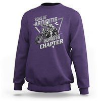 Purple crewneck sweatshirt with biker skeleton graphic and bold text print