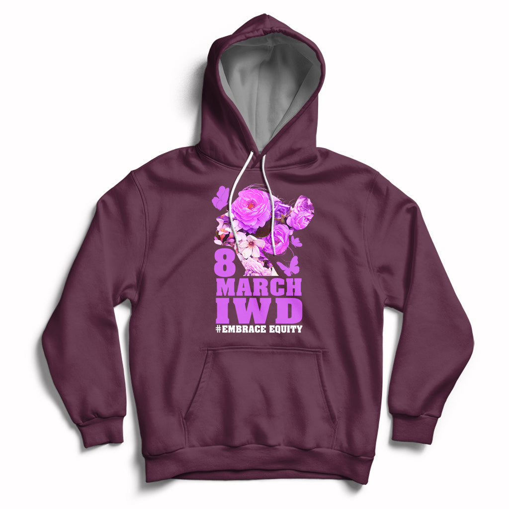 Women's maroon pullover hoodie with front '8 MARCH IWD' and '#EMBRACE EQUITY' graphic