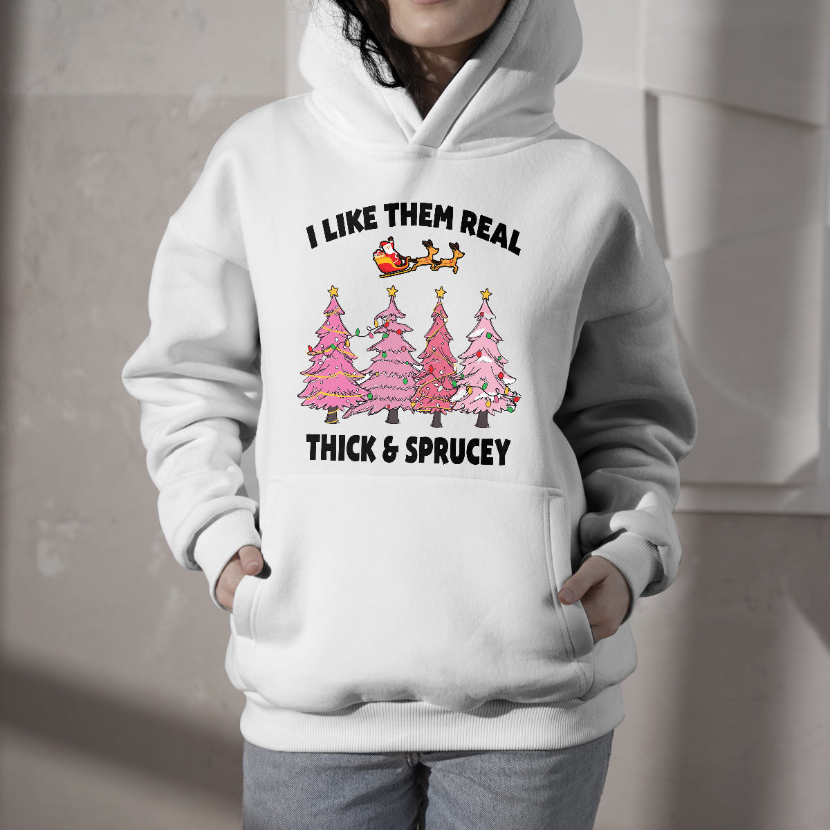 White pullover hoodie with front graphic of pink Christmas trees and text