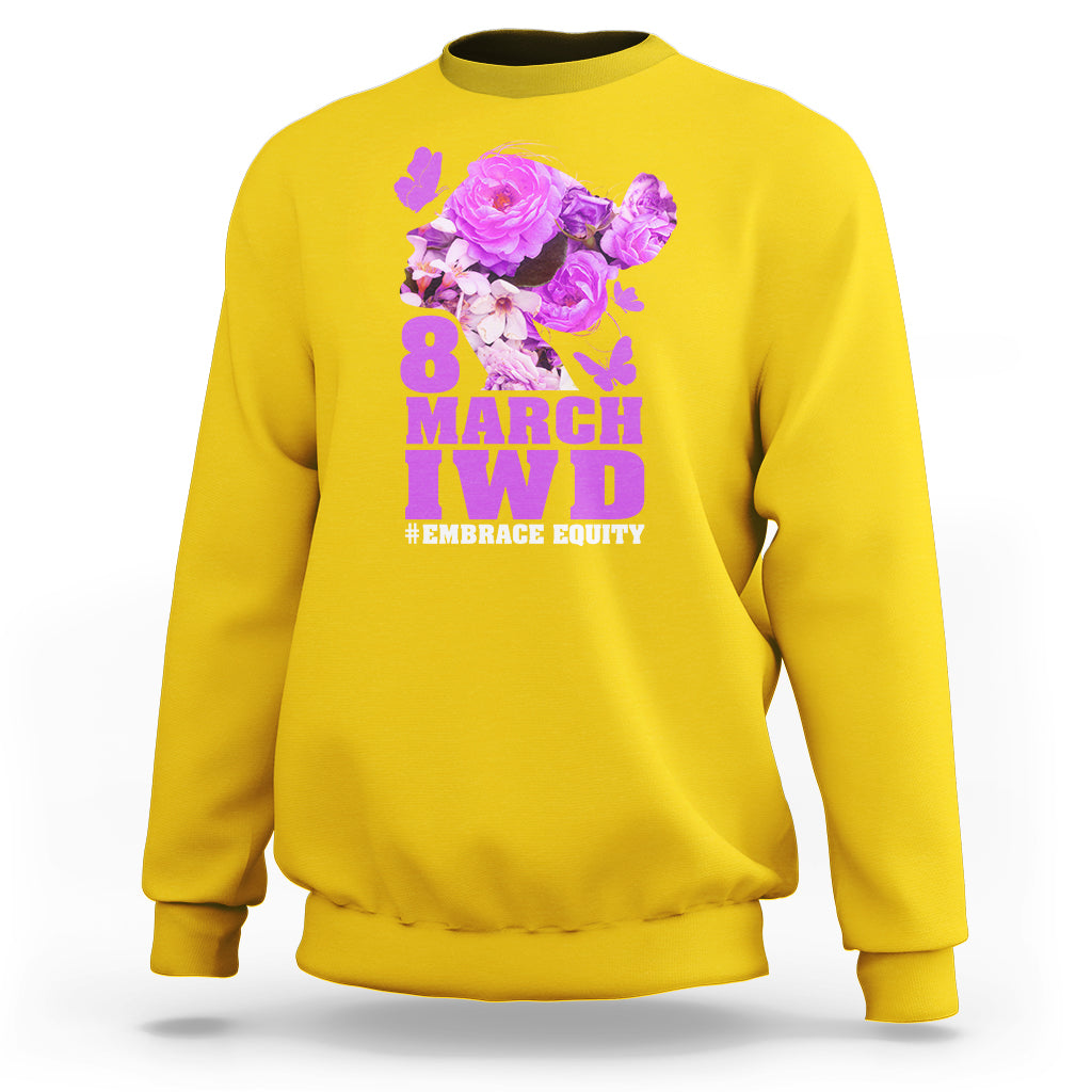 Daisy yellow women’s sweatshirt with floral IWD graphic and text #EMBRACE EQUITY on front