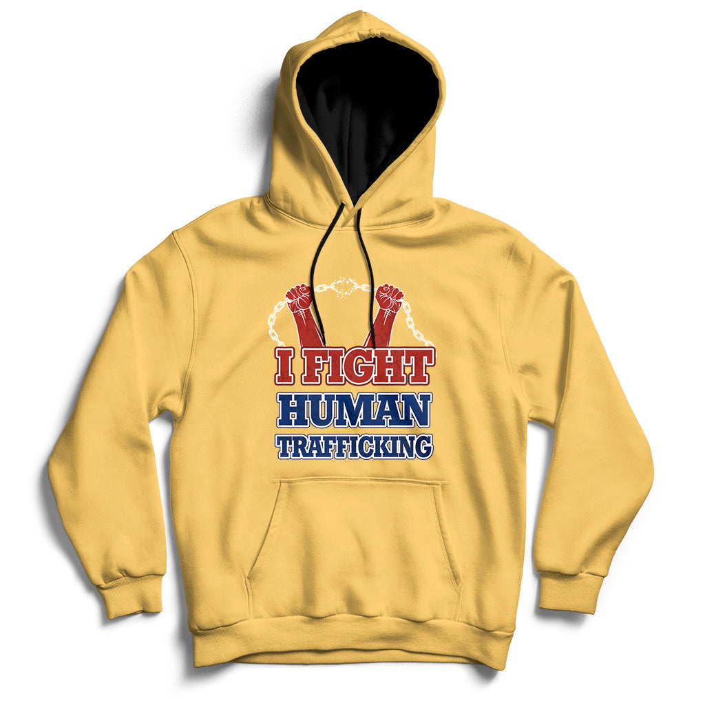 Yellow hoodie with front graphic text "I FIGHT HUMAN TRAFFICKING" and chain design