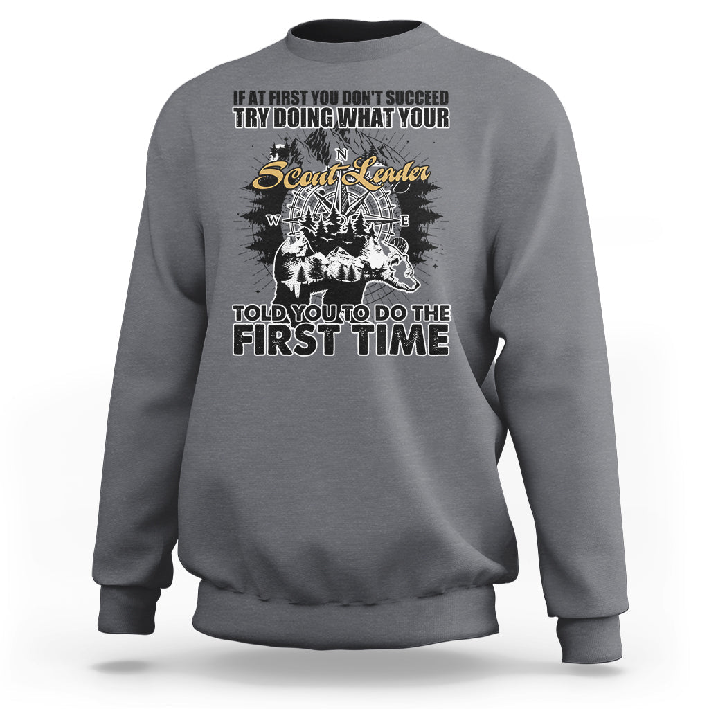 Charcoal crewneck sweatshirt with back graphic print and compass-style design.