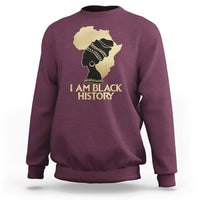 Maroon crewneck sweatshirt with front graphic of profile and text "I AM BLACK HISTORY".