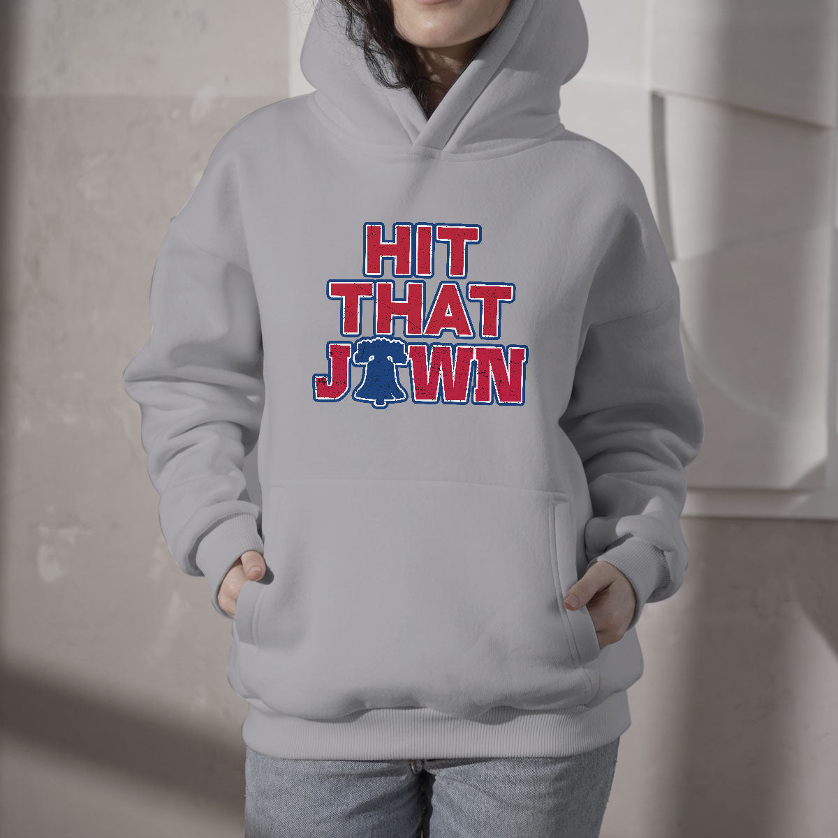 White hooded sweatshirt with front pocket and 'HIT THAT JAWN' graphic