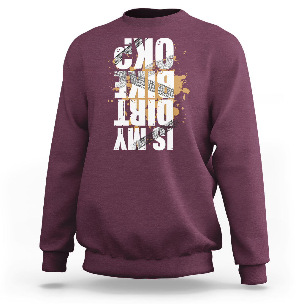 Maroon crewneck sweatshirt with distressed front graphic print, long sleeves and ribbed cuffs