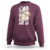 Maroon crewneck sweatshirt with distressed front graphic print, long sleeves and ribbed cuffs