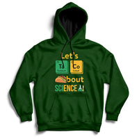 Forest green science hoodie with front graphic reading “Let’s Taco Bout SCIENCE”.