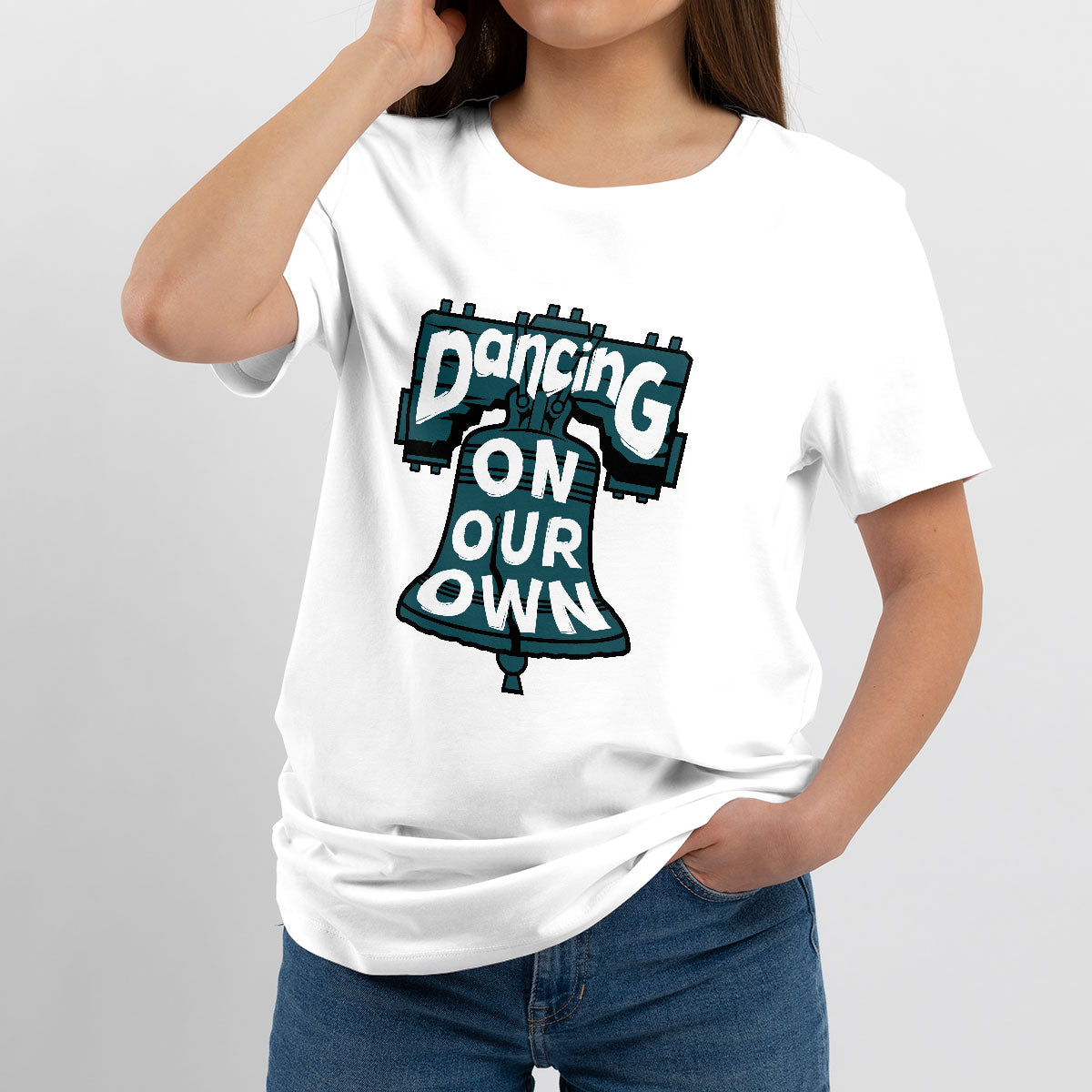 White crew-neck T-shirt worn by model, featuring colorful "Dancing On Our Own" graphic.