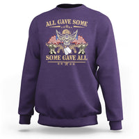 Purple crewneck sweatshirt with eagle and U.S. flag graphic and patriotic text on back