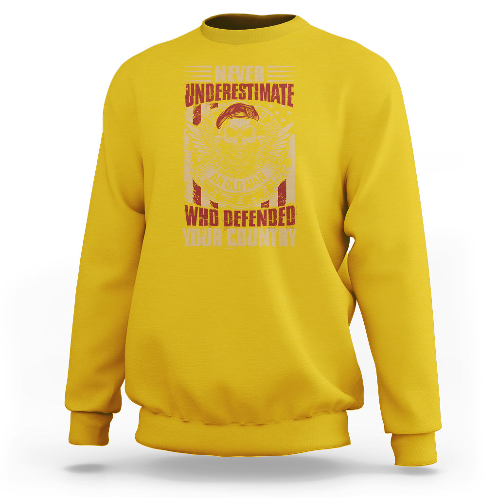 Yellow crewneck sweatshirt with front skull-and-wings patriotic graphic and text