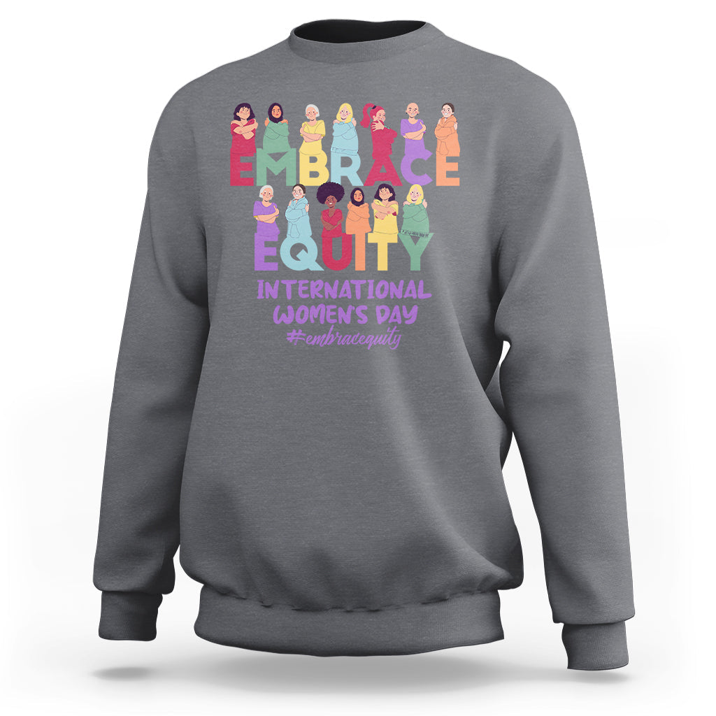 Charcoal gray crewneck sweatshirt with colorful “EMBRACE EQUITY” women’s day graphic on back