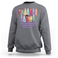 Charcoal gray crewneck sweatshirt with colorful “EMBRACE EQUITY” women’s day graphic on back
