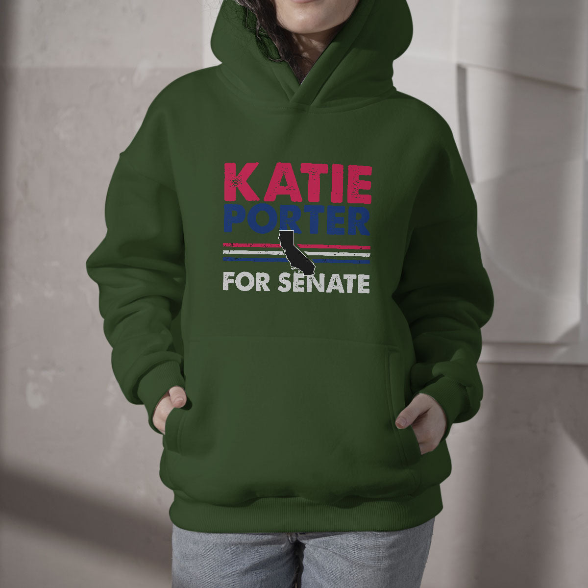 Green hoodie with hood, front pouch, and "KATIE PORTER FOR SENATE" graphic