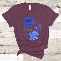 Maroon T-shirt with blue elephant graphic, sunflower, and ribbon awareness design
