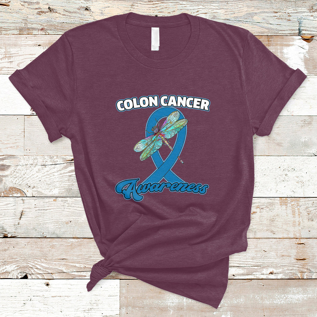 Maroon colon cancer awareness T-shirt with dragonfly over blue ribbon graphic