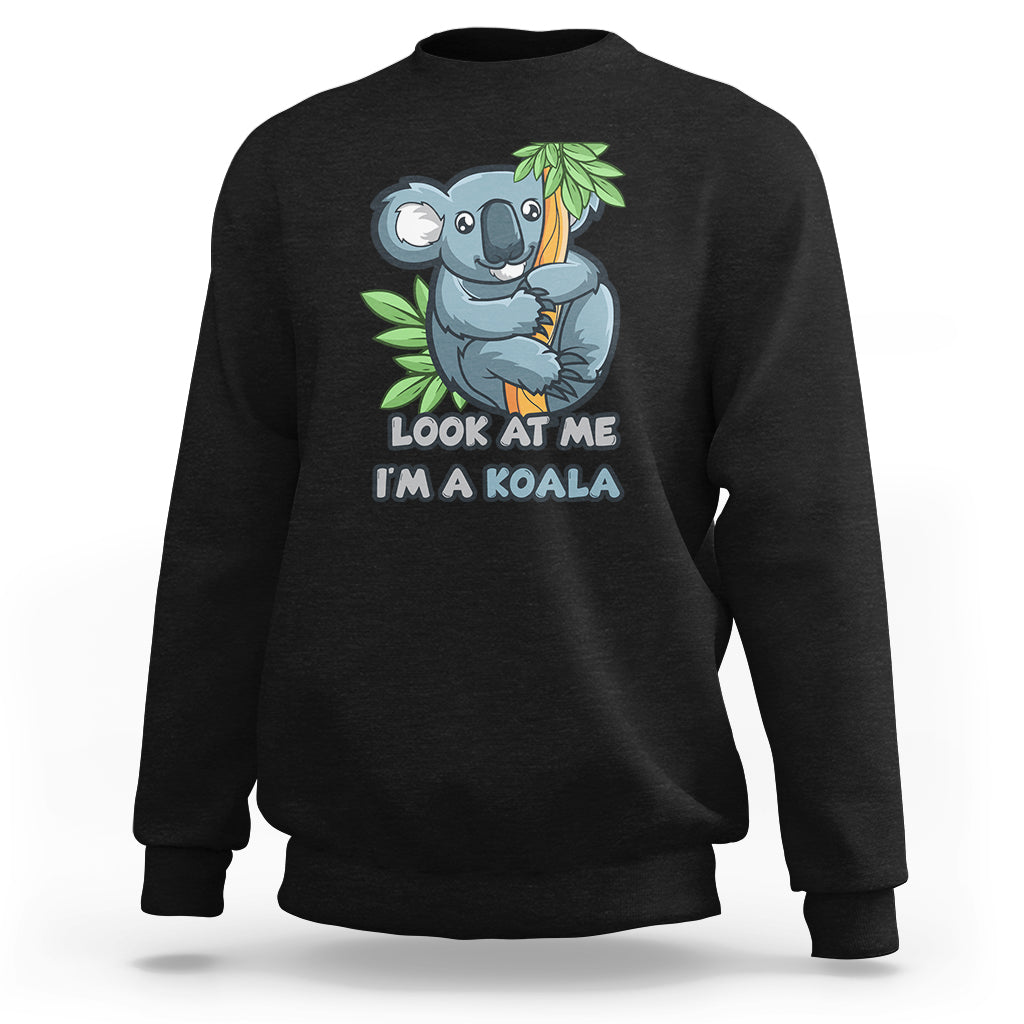 Black crewneck sweatshirt with koala graphic and 'LOOK AT ME I'M A KOALA' text