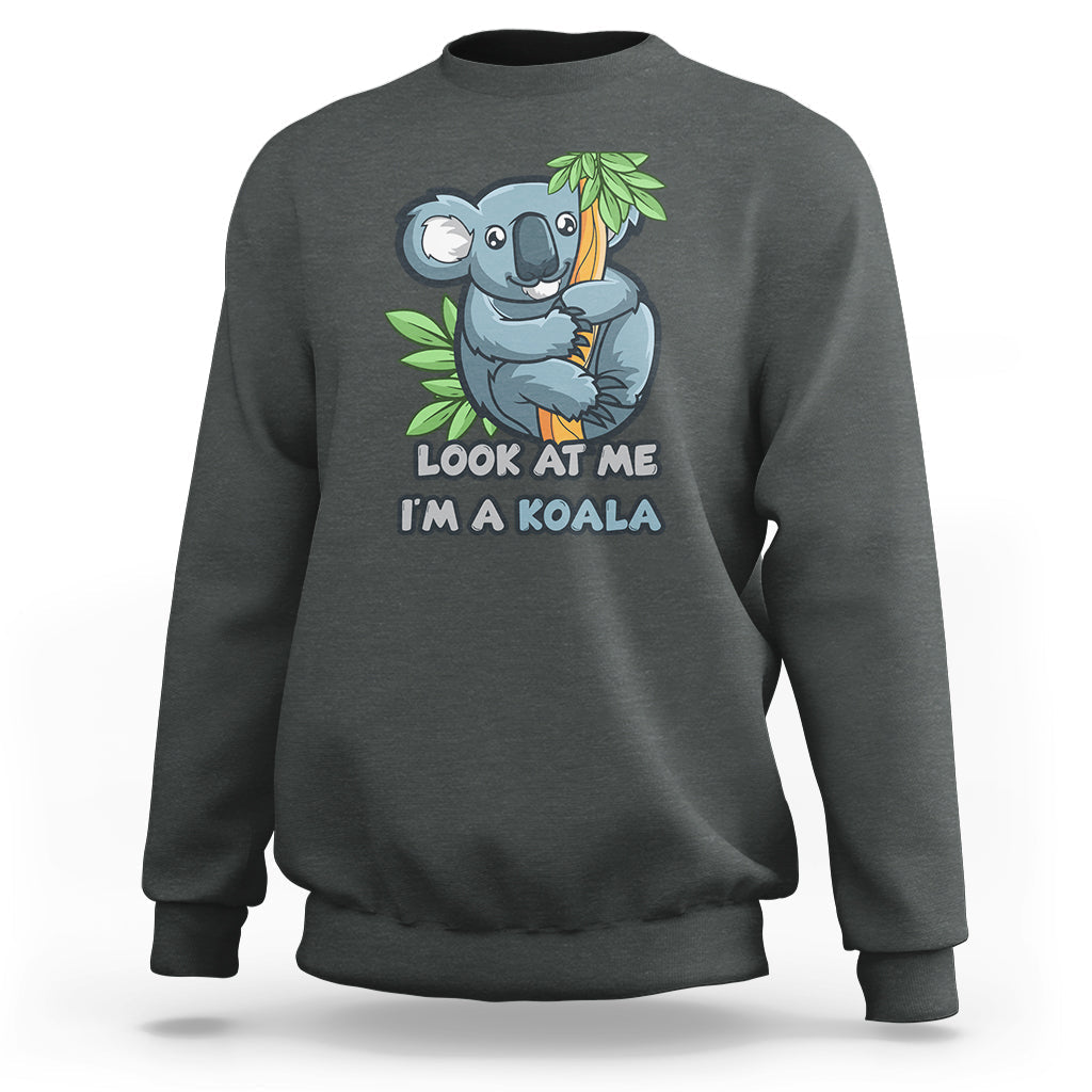 Dark heather crewneck sweatshirt with koala graphic and 'LOOK AT ME I'M A KOALA' text